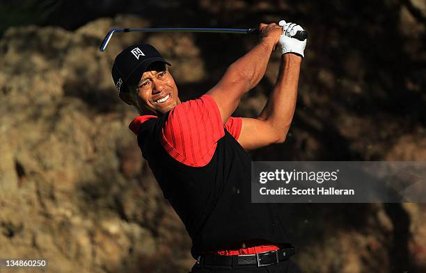Tiger Woods watches his tee shot on the 15th hole during the final round of the Chevron World Challenge at Sherwood Country Club on December 4, 2011...