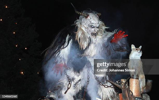 Members of the Koatlacker devil's association dressed as demonic creatures take part in a Krampus procession on December 4, 2011 in Prad near Merano,...