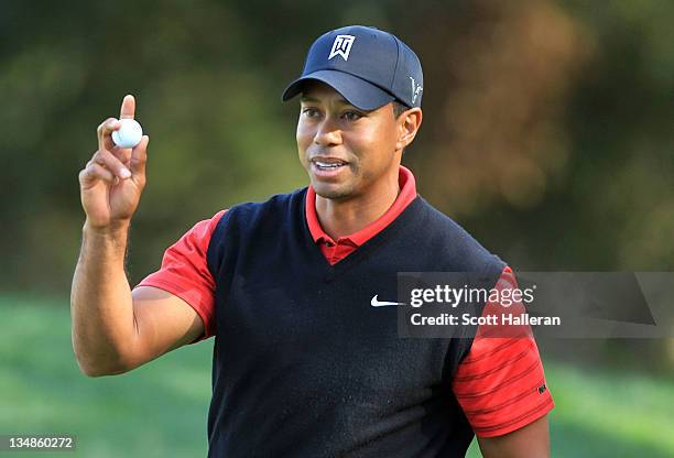 Tiger Woods celebrates a birdie putt on the tenth hole during the final round of the Chevron World Challenge at Sherwood Country Club on December 4,...