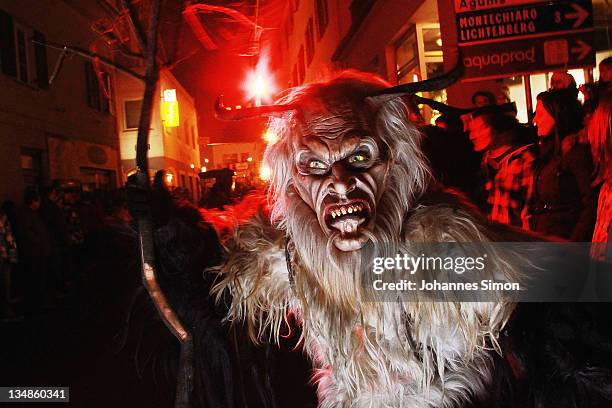 Members of the Koatlacker devil's association dressed as demonic creatures take part in a Krampus procession on December 4, 2011 in Prad near Merano,...