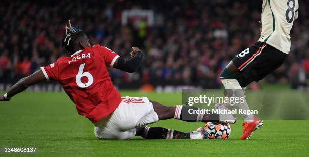 Naby Keita of Liverpool is fouled by Paul Pogba of Manchester United leading to a red card being shown following a VAR review during the Premier...