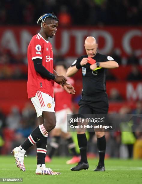 Paul Pogba of Manchester United looks dejected after being shown a red card by Match Referee, Anthony Taylor during the Premier League match between...