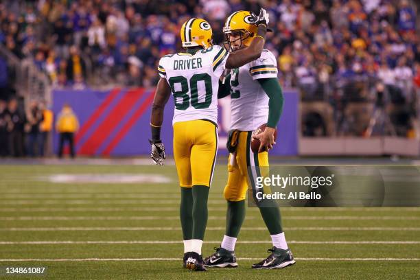 Aaron Rodgers and Donald Driver of the Green Bay Packers celebrate after Driver caught a 7-yard touchdown reception from Rodgers against the New York...