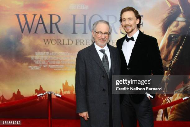 Director and producer Steven Spielberg and actor Tom Hiddleston attend the "War Horse" world premiere at Avery Fisher Hall at Lincoln Center for the...