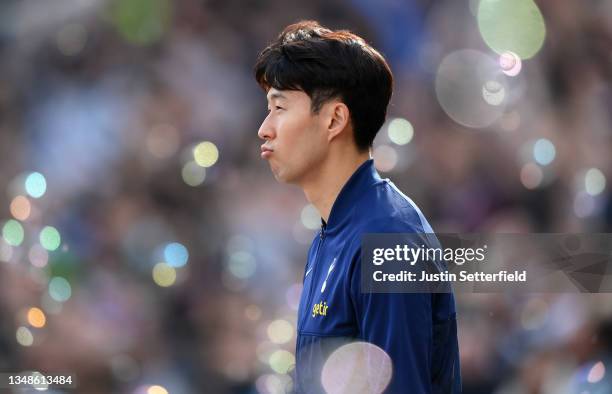 Son Heung-Min of Tottenham Hotspur walks onto the pitch for the Premier League match between West Ham United and Tottenham Hotspur at London Stadium...