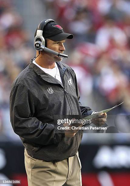 Head coach Ken Whisenhunt watches from the sidelines during the NFL game against the Dallas Cowboys at the University of Phoenix Stadium on December...