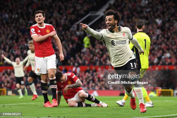 Mohamed Salah of Liverpool celebrates after scoring their side's third goal during the Premier League match between Manchester United and Liverpool...