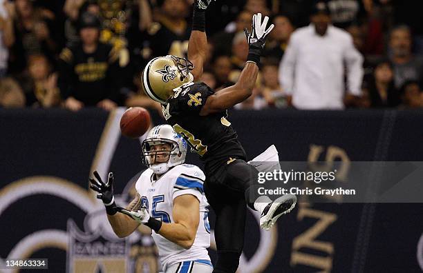 Tight end Tony Scheffler of the Detroit Lions makes a 36 yard catch as cornerback Jabari Greer of the New Orleans Saints defends in the third quarter...