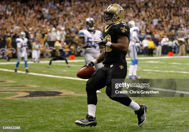 Running back Darren Sproles of the New Orleans Saints scores a touchdown against the Detroit Lions in the fourth quarter at Mercedes-Benz Superdome...