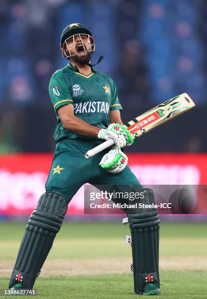 Babar Azam of Pakistan celebrates after winning by 10 wickets following the ICC Men's T20 World Cup match between India and Pakistan at Dubai...