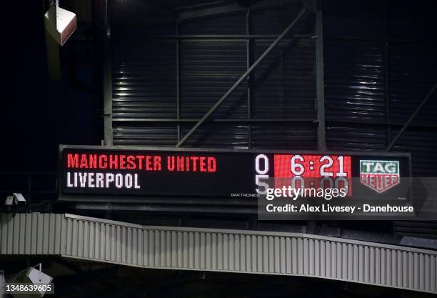 The score board can be seen at full time indicating a score of 0-5 during the Premier League match between Manchester United and Liverpool at Old...