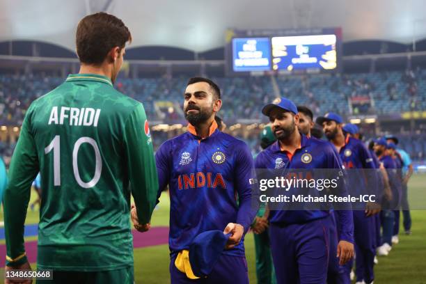 Shaheen Afridi of Pakistan and Virat Kohli of India shake hands following the ICC Men's T20 World Cup match between India and Pakistan at Dubai...