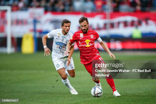 Andreas Ulmer of FC Red Bull Salzburg challenged by Andreas Kuen of Sturm Graz during the Admiral Bundesliga match between FC Red Bull Salzburg and...