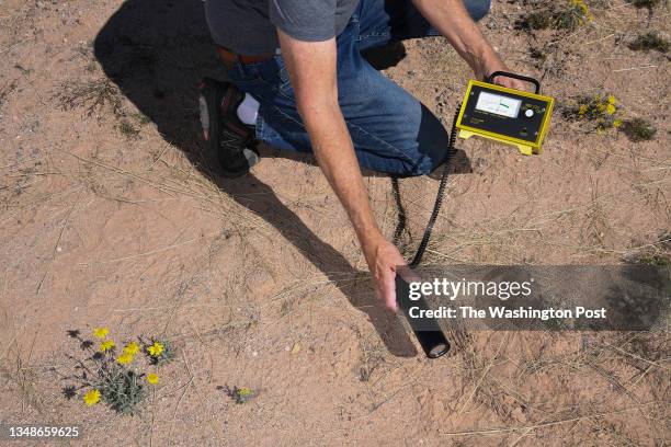 Bob Bell uses equipment to tests for radioactivity as he and others visited the Trinity Site during an open house on Saturday October 15, 2022 in...