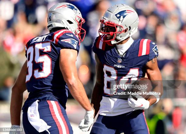 Hunter Henry of the New England Patriots celebrates with Kendrick Bourne after a touchdown during the first half in the game against the New York...