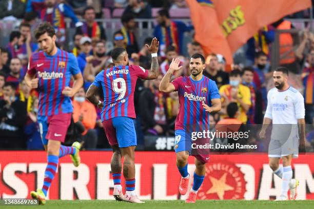 Sergio Aguero of FC Barcelona celebrates after scoring his team's first goal during the La Liga Santander match between FC Barcelona and Real Madrid...