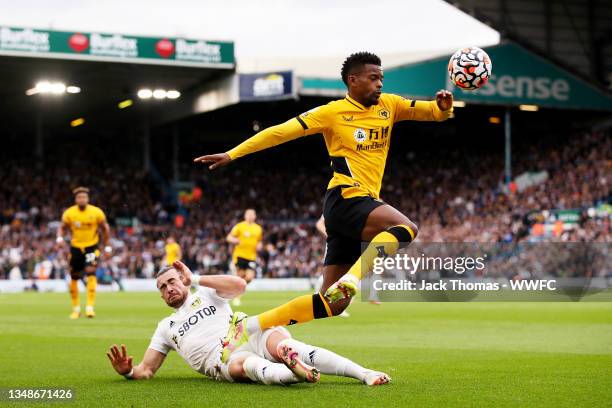 Nelson Semedo of Wolverhampton Wanderers is challenged by Jack Harrison of Leeds United during the Premier League match between Leeds United and...