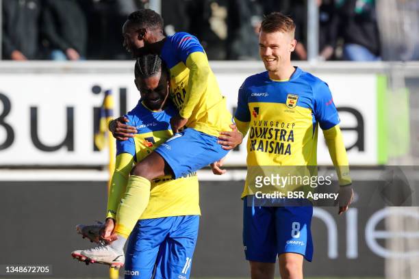 David Sambissa of SC Cambuur celebrates after scoring his side's second goal with Issa Kallon of SC Cambuur and Jamie Jacobs of SC Cambuur during the...