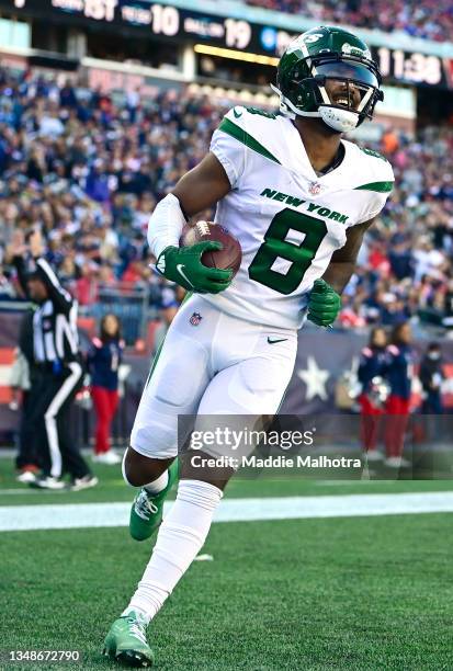 Elijah Moore of the New York Jets scores a touchdown during the third quarter in the game against the New England Patriots at Gillette Stadium on...