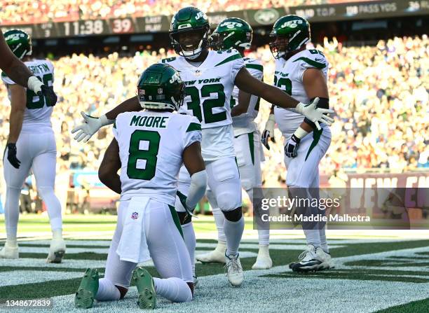 Elijah Moore of the New York Jets celebrates after scoring a touchdown during the third quarter in the game against the New England Patriots at...