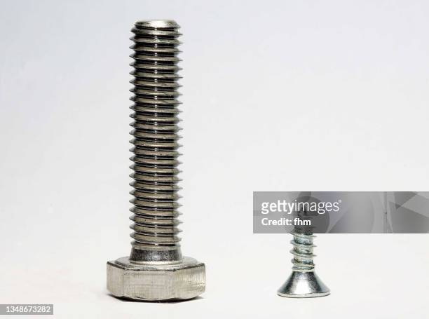 two screws - werkzeug freisteller stock-fotos und bilder