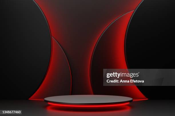 luxury round black podium with red backlighting on abstract black background with many black circles also with red backlighting. perfect platform for showing your products. three dimensional illustration - concurso fotografías e imágenes de stock