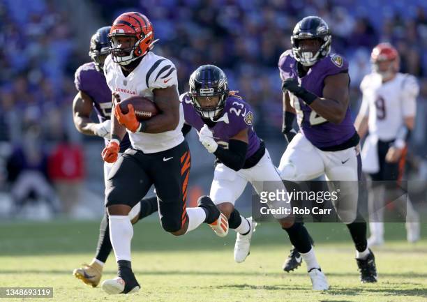 Samaje Perine of the Cincinnati Bengals rushes for a touchdown during the second half as Anthony Averett of the Baltimore Ravens defends in the game...