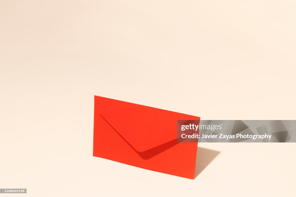 Closed Red Envelope On A Pastel Background