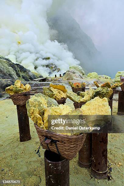 sulfur baskets and smoking sulfur pipes, kawa ijen - sulphur stock pictures, royalty-free photos & images