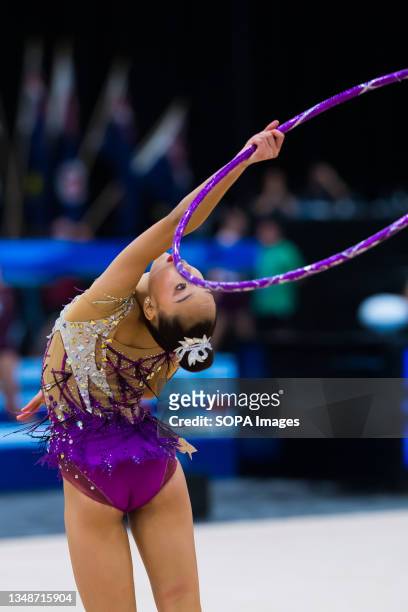 Australian Senior International Rhythmic Gymnast from Queensland, Riana Narushima up close is looking at the hoop while bending backwards, during...