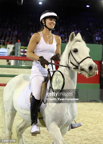Martina Hingins in fancy dress rides during the International Gucci Masters competition on December 2, 2011 in Villepinte, France.