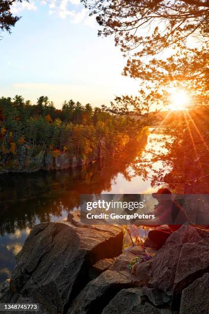 male rock climber securing ropes - minnesota river stock pictures, royalty-free photos & images