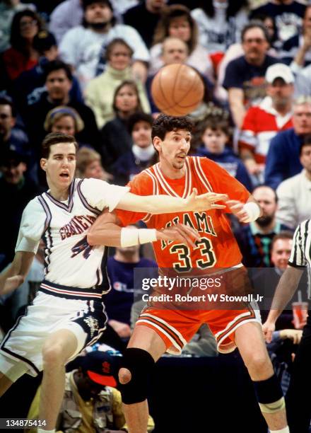 Miami University's Constantine Popa and UConn's Travis Knight battle for the basketball, Hartford CT 1994.