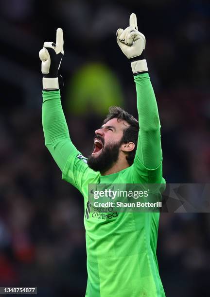 Allison Becker of Liverpool celebrates during the Premier League match between Manchester United and Liverpool at Old Trafford on October 24, 2021 in...