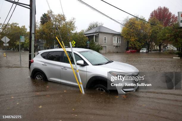 Car sits stranded on a flooded street on October 24, 2021 in San Rafael, California. A Category 5 atmospheric river is bringing heavy precipitation,...