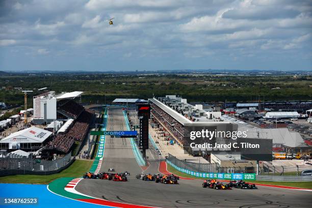 Lewis Hamilton of Great Britain driving the Mercedes AMG Petronas F1 Team Mercedes W12 and Max Verstappen of the Netherlands driving the Red Bull...