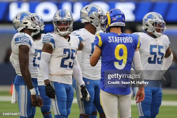 Matthew Stafford of the Los Angeles Rams talks to former teammates during the fourth quarter against the Detroit Lions at SoFi Stadium on October 24,...