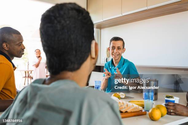 sign language during breakfast - group of people using sign language stock pictures, royalty-free photos & images