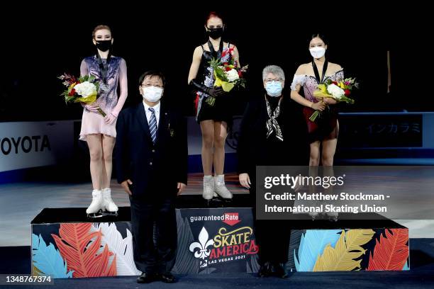 Daria Usacheva of Russia, Alexandra Trusova of Russia and Young You of South Korea pose on the medal podium after skating in the Women's Competition...