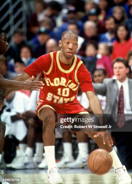 Florida State's point guard Sam Cassell keeps a wary eye on the oppositionas he dribbles up court against the UConn Huskies, Storrs CT 1992.