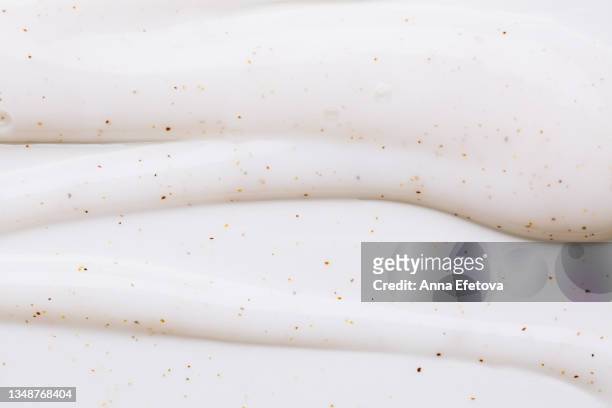 texture of white body scrub with exfoliating particles. flat lay style - glace texture imagens e fotografias de stock