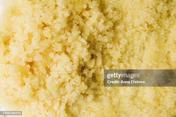 texture of pastel yellow sugar scrub. concept of body care. trendy color of the year. flat lay style - jojoba oil stock pictures, royalty-free photos & images