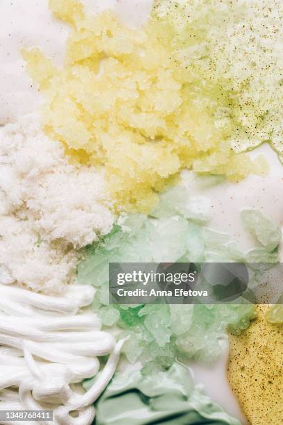 shower gels, sugar scrubs, shaving gel and moisturizing cream on white background. morning bath set for body care. flat lay style - coconut shaving stock pictures, royalty-free photos & images