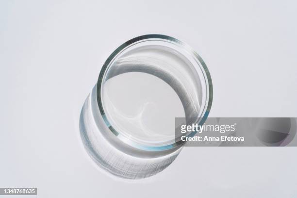 empty petri dish on gray background. concept of laboratory researches. photography in flat lay style - vidro - fotografias e filmes do acervo
