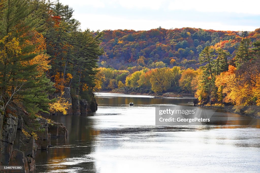 River and cliffs with vibrant fall colors