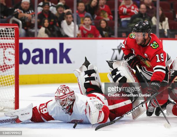 Alex Nedeljkovic of the Detroit Red Wings makes a save against a shot by Jonathan Toews of the Chicago Blackhawks at the United Center on October 24,...