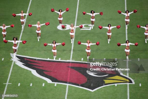 The Arizona Cardinals cheerleaders perform before the NFL game against the Houston Texans at State Farm Stadium on October 24, 2021 in Glendale,...