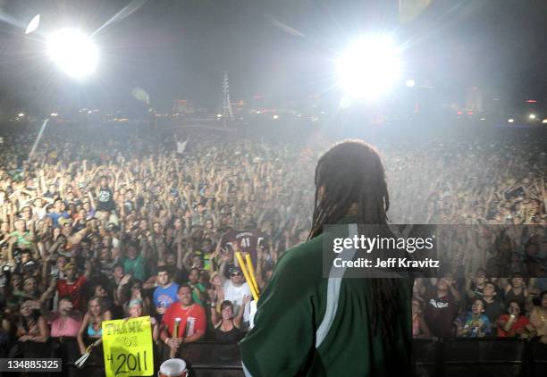 Drummer Carter Beauford throws drum sticks to fans during day two of Dave Matthews Band Caravan at Bader Field on June 25, 2011 in Atlantic City, New...