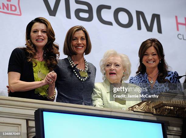 Jane Leeves,Wendie Malick, Betty White and Valerie Bertinelli ring the opening bell at the New York Stock Exchange on June 15, 2010 in New York City.