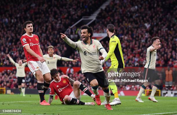 Mohamed Salah of Liverpool celebrates after scoring their side's third goal during the Premier League match between Manchester United and Liverpool...